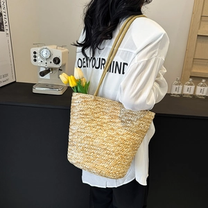 Handwoven straw bucket bag for summer vacation with long strap and large capacity