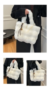 Detail of white faux fur tote bag with plush texture and decorative bell charm