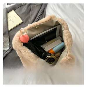 Large capacity plush tote bag interior showing tablets and essentials with magnetic buckle