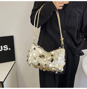 Detail of sequin shoulder bag with champagne metallic discs and knotted strap