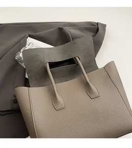Close-up of the beige lychee pattern leather tote bag with soft matte interior lining