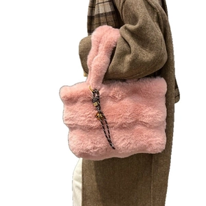 Pink plush faux fur tote bag for women with soft texture and decorative woven rope accent