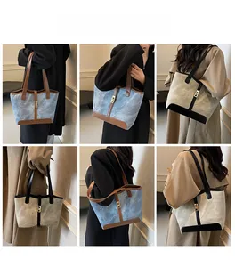 Détail du sac cabas en denim rétro avec bordure contrastée et boucle métallique