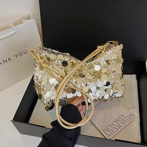 Chic gold sequin underarm bag with woven strap presented in a premium gift box