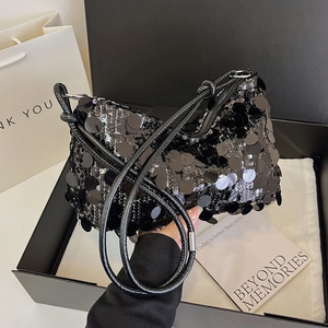 Chic black sequin underarm bag with glossy finish in a gift box for evening party