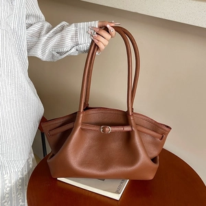 Brown lychee leather tote bag with pleated design and golden buckle accent