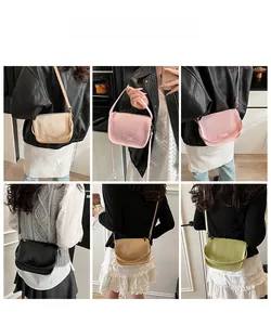 Vertical pleated texture bucket bag in five colors showing adjustable shoulder strap details