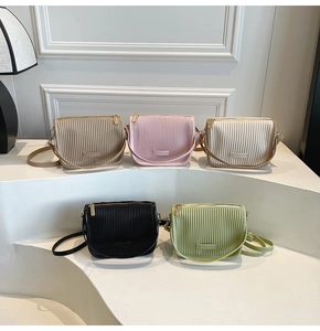 Close-up of pleated vertical textures on bucket bags in five stylish pastel colors