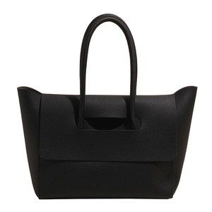Classic black lychee pattern leather tote bag with dual handles and unique flap design