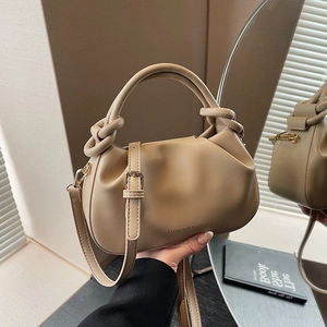Beige pleated cloud tote bag with knotted handle and adjustable strap for women
