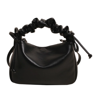 Minimalist black soft leather shoulder bag with cloud-pleated handle and side drawstring