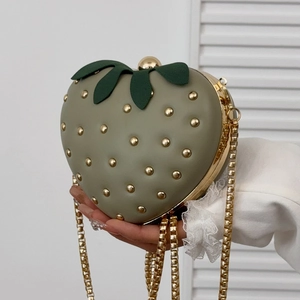 Unique strawberry shaped hard shell crossbody bag with rivets and gold chain strap