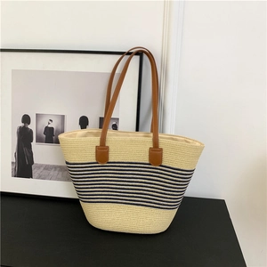 Striped straw tote bag with brown leather handles and large capacity for summer beach holidays
