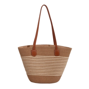 Large capacity striped straw tote bag with brown leather handles for summer beach vacations