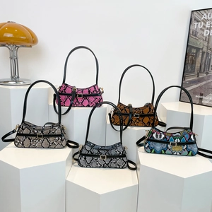 Chic snakeskin texture shoulder bags in five colors on geometric display stands