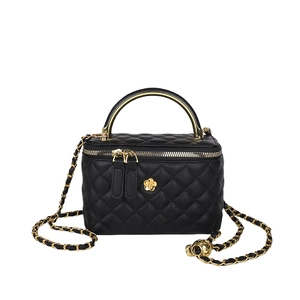 Black quilted crossbody bucket bag with golden camellia flower and chain strap