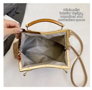 Top view of retro frame handbag showing spacious interior and golden metal closure
