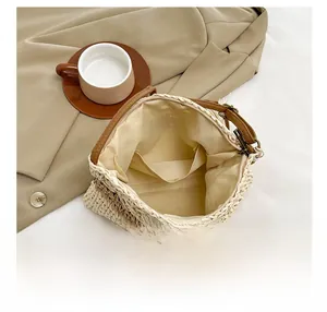 Detail view of woven straw bag interior with zipper closure and smooth fabric lining