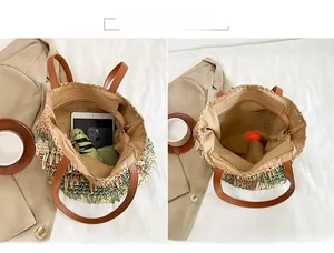 Detail view of large straw tote with contrasting panels showing its spacious storage capacity