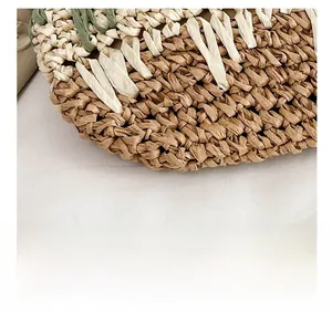 Detail of multi-color block straw weave texture with green and beige handwoven fibers