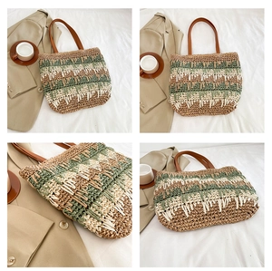 Detail of color-block straw bag showing woven texture and brown leather strap