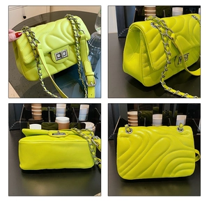 Detail view of neon green quilted crossbody bag with silver hardware and chain strap