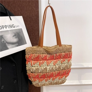 Contrast color red and white straw shoulder bag with long brown leather handles