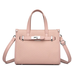 Pink lychee texture handbag with silver twist lock and woven pattern for crossbody use