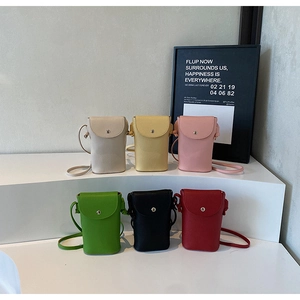 Detail of six colorful litchi grain leather crossbody phone bags with magnetic closures