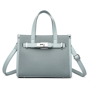 Light blue woven leather tote bag with metal twist lock and detachable strap