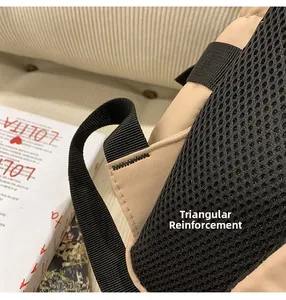 Close-up of triangular reinforcement stitching on backpack straps for extra durability