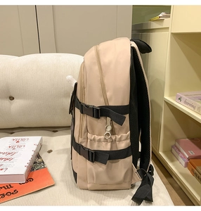 Detailed side view of beige nylon backpack with breathable mesh back and adjustable straps