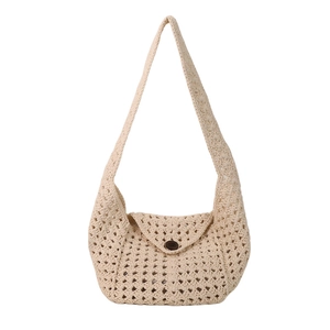 Minimalist woven tote bag with hollow crochet pattern and wooden buckle in beige