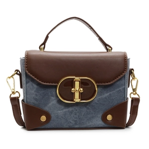 Retro denim and brown leather contrast handbag with a large gold metal lock buckle