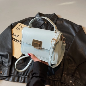 Light blue crossbody square bag with gold lock buckle and adjustable strap for women