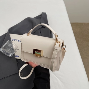 Chic beige crossbody square bag with gold buckle and top handle for elegant daily styling