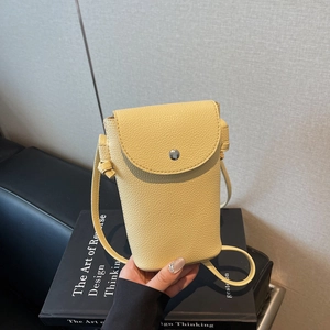 Minimalist yellow lychee grain leather mini crossbody bag with magnetic flap closure
