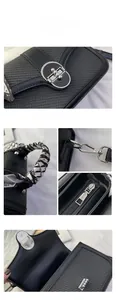 Detail of black woven texture bag with silver twist lock and scarf wrapped handle