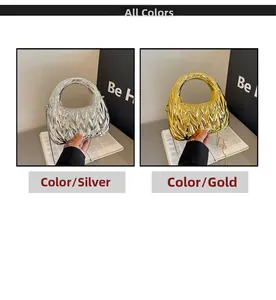 Detail of silver and gold pleated acrylic evening bags with elegant metal chain straps