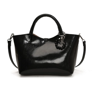 Glossy black patent leather handbag with top handle and detachable strap for women