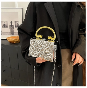 Silver ripple acrylic evening bag with gold dragon handle and metal chain strap