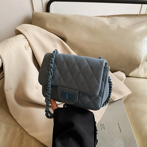 Elegant blue quilted crossbody bag with chain strap and turn-lock closure for women