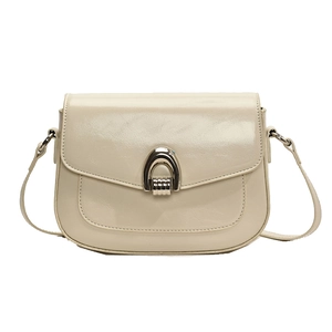Minimalist cream leather saddle bag with silver metal U-buckle for modern women