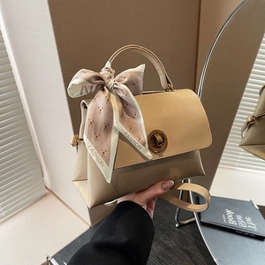 Chic beige crossbody bag with fashion scarf handle and vintage metal lock closure