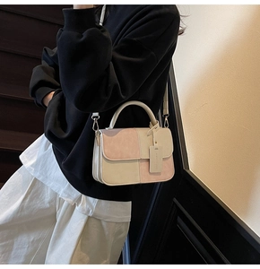 Chic pink and beige patchwork crossbody bag shown styled with a modern outfit