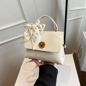 Chic cream white shoulder bag with gold twist lock and bear print silk scarf decor