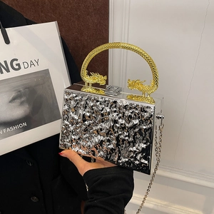Silver wavy texture acrylic clutch bag with golden double dragon circular handle