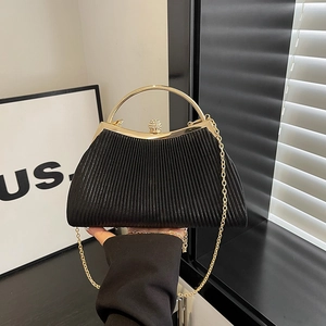 Elegant black pleated evening bag with gold ring handle and diamond spherical lock