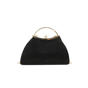 Elegant black pleated evening bag with gold ring handle and sparkling crystal clasp