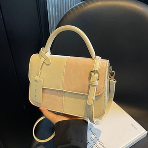Retro two-tone beige and pink patchwork handbag with top handle and shoulder strap